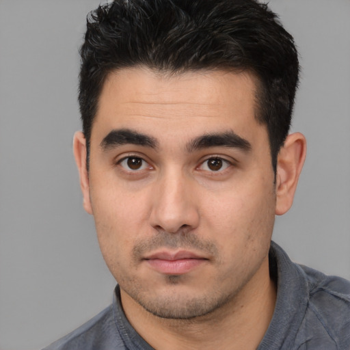 Neutral white young-adult male with short  black hair and brown eyes