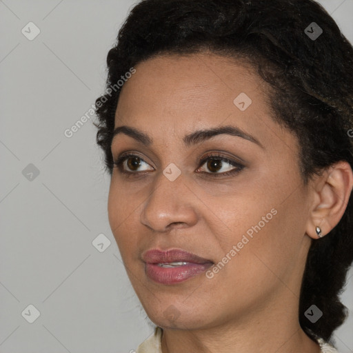 Joyful black young-adult female with short  brown hair and brown eyes