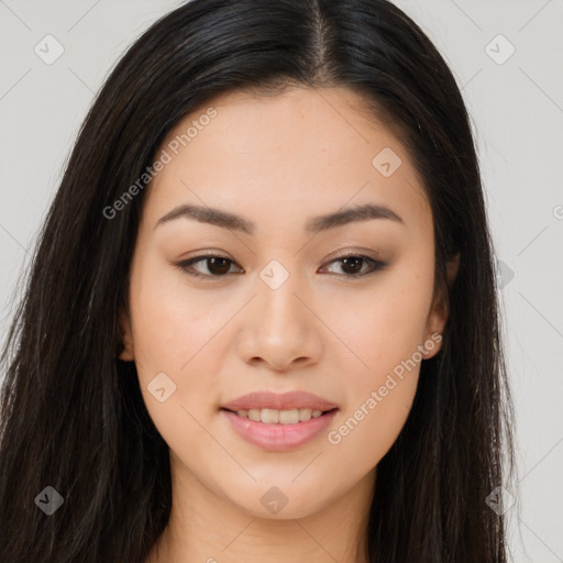 Joyful asian young-adult female with long  brown hair and brown eyes