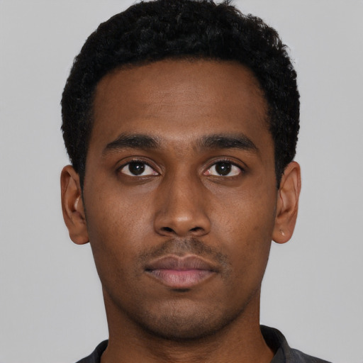 Neutral black young-adult male with short  black hair and brown eyes