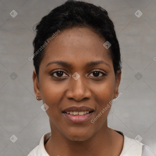 Joyful black young-adult female with short  black hair and brown eyes