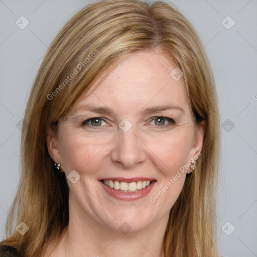 Joyful white adult female with medium  brown hair and blue eyes