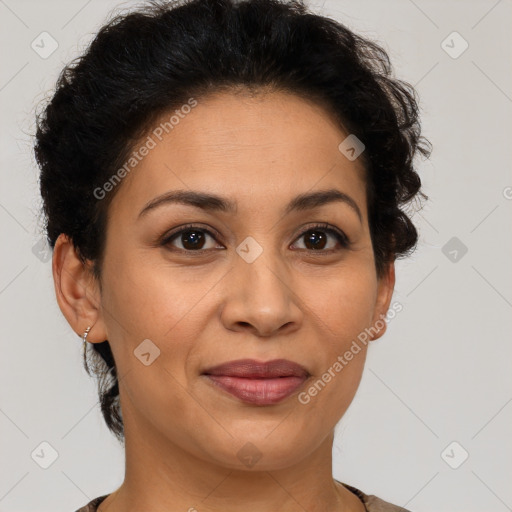 Joyful latino adult female with short  brown hair and brown eyes