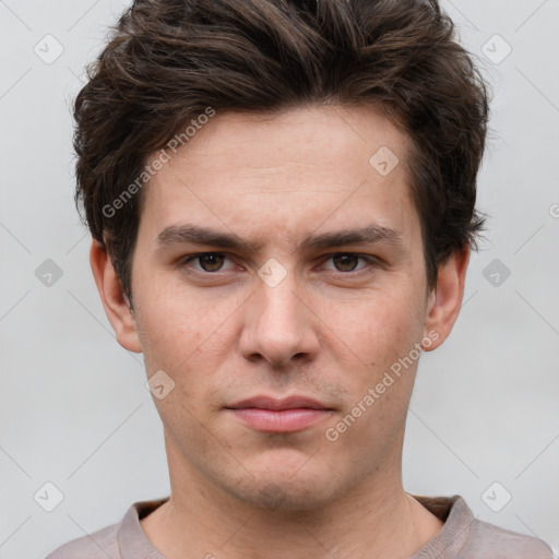 Neutral white young-adult male with short  brown hair and grey eyes