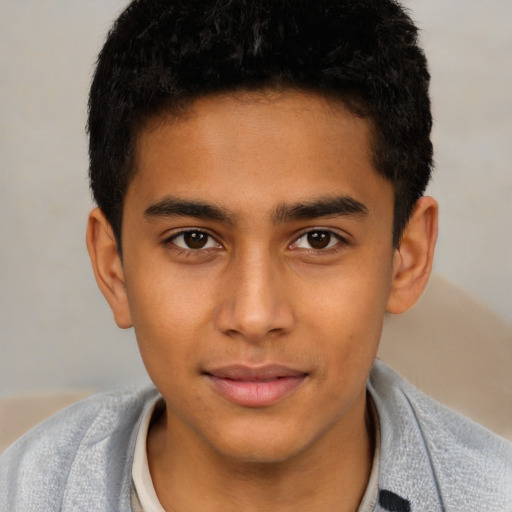 Joyful latino young-adult male with short  brown hair and brown eyes