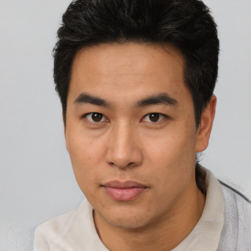 Neutral asian young-adult male with short  black hair and brown eyes