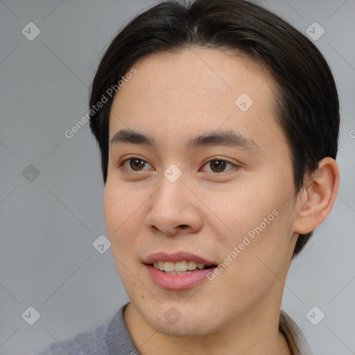 Joyful asian young-adult male with short  brown hair and brown eyes