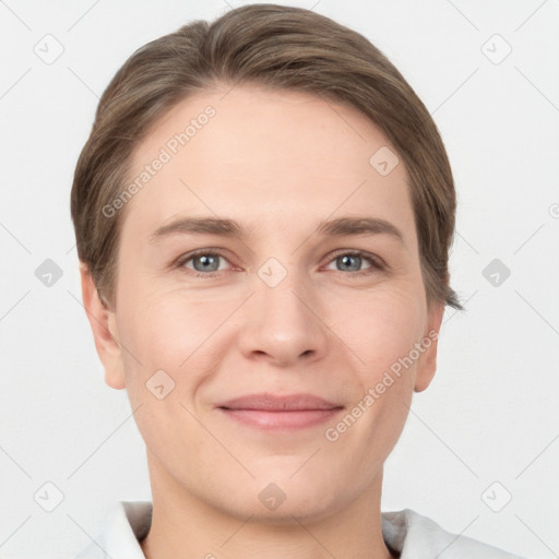 Joyful white young-adult female with short  brown hair and grey eyes