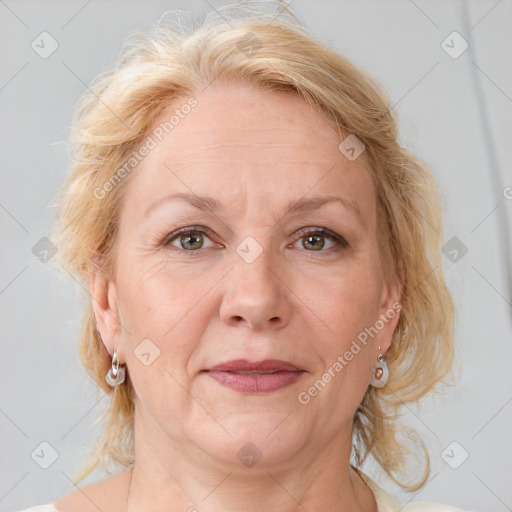 Joyful white adult female with medium  brown hair and blue eyes