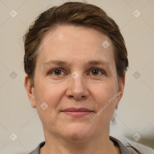 Joyful white adult female with short  brown hair and brown eyes