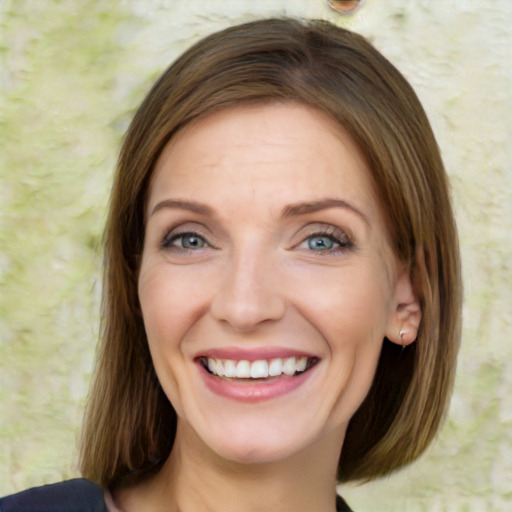 Joyful white young-adult female with medium  brown hair and blue eyes