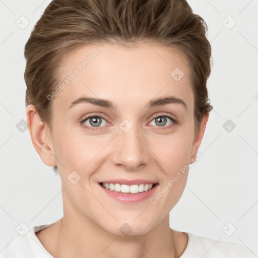 Joyful white young-adult female with short  brown hair and grey eyes