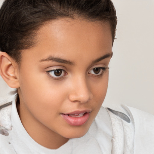 Joyful white child female with short  brown hair and brown eyes