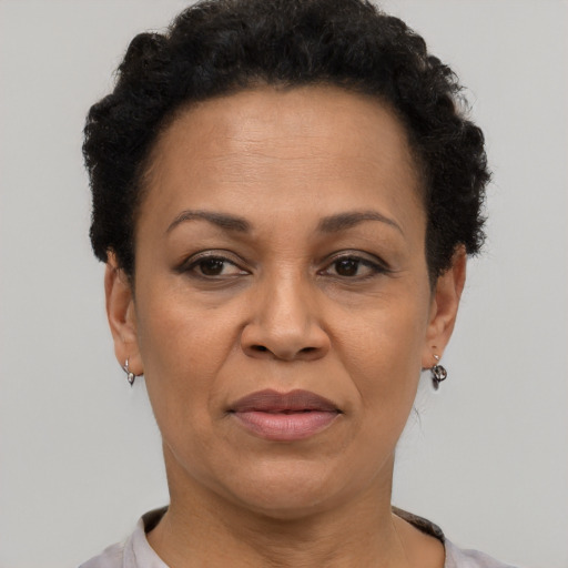 Joyful black adult female with short  brown hair and brown eyes