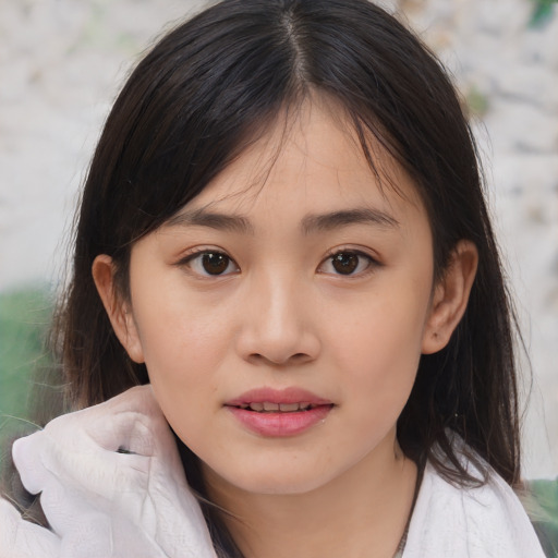 Joyful white child female with medium  brown hair and brown eyes