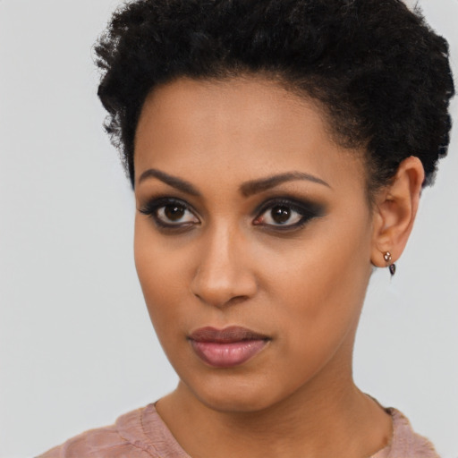 Joyful latino young-adult female with short  black hair and brown eyes