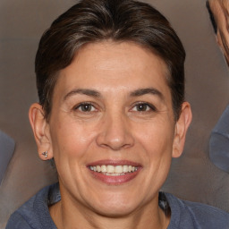 Joyful white adult female with short  brown hair and brown eyes