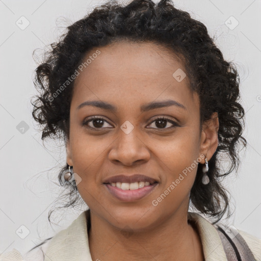 Joyful black young-adult female with long  brown hair and brown eyes