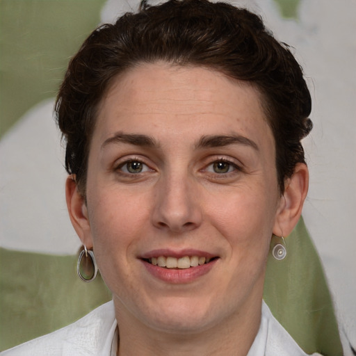 Joyful white adult female with short  brown hair and brown eyes