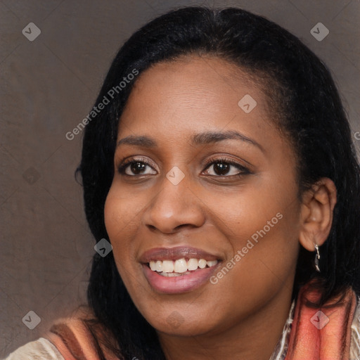 Joyful black young-adult female with long  black hair and brown eyes