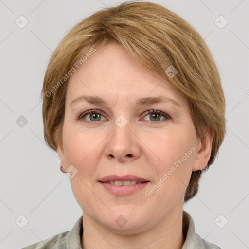 Joyful white adult female with short  brown hair and grey eyes