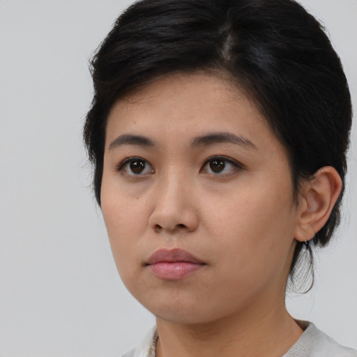 Neutral asian young-adult female with medium  brown hair and brown eyes