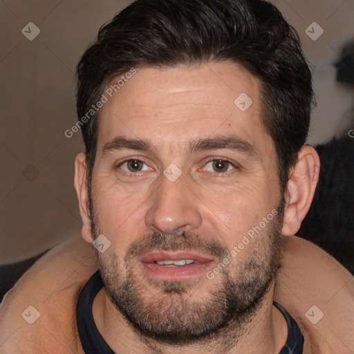 Joyful white adult male with short  brown hair and brown eyes