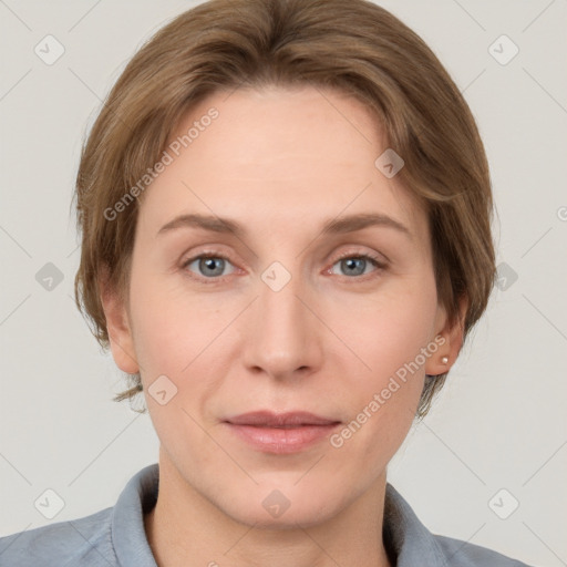 Joyful white adult female with medium  brown hair and grey eyes