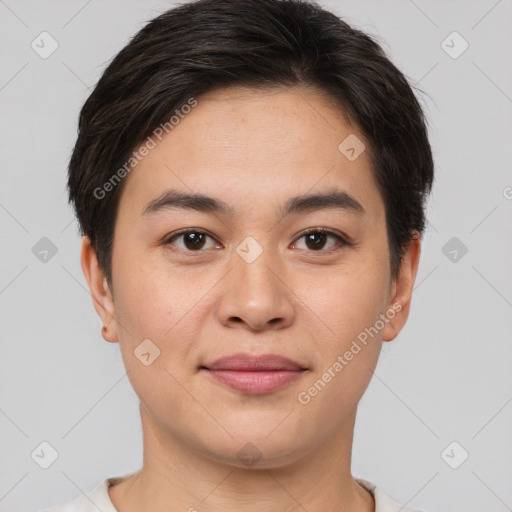 Joyful asian young-adult male with short  brown hair and brown eyes