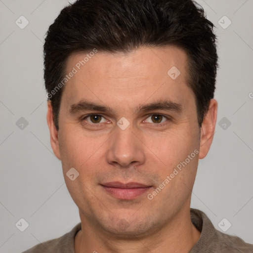 Joyful white adult male with short  brown hair and brown eyes