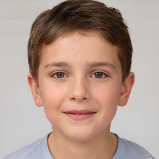 Joyful white child male with short  brown hair and brown eyes