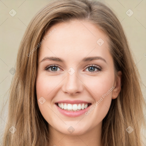 Joyful white young-adult female with long  brown hair and green eyes