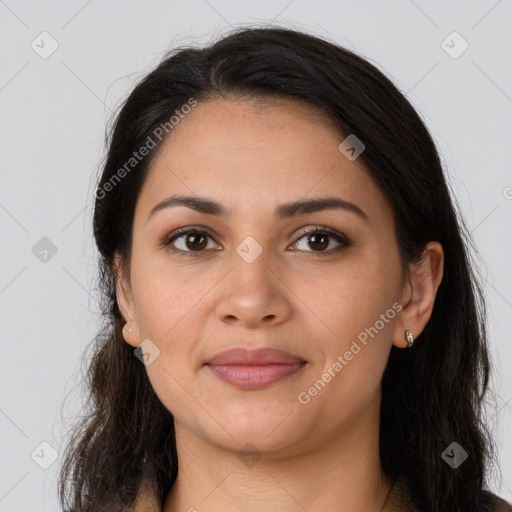 Joyful latino young-adult female with long  brown hair and brown eyes