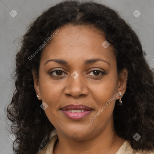 Joyful black young-adult female with long  brown hair and brown eyes