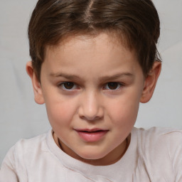 Joyful white child female with short  brown hair and brown eyes