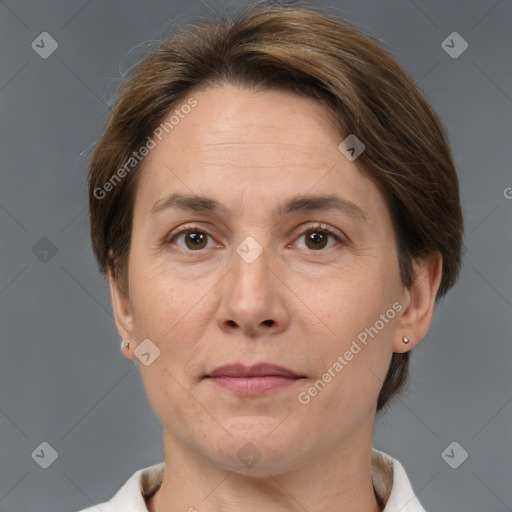 Joyful white adult female with medium  brown hair and brown eyes