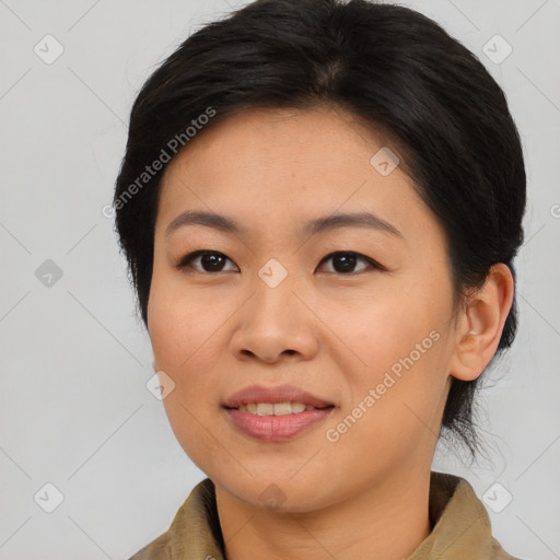 Joyful asian young-adult female with medium  brown hair and brown eyes