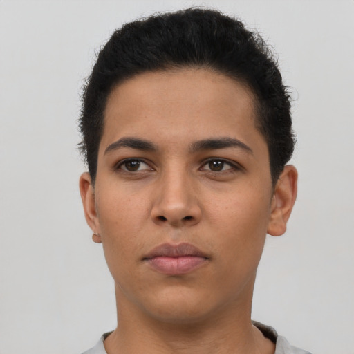 Neutral latino young-adult male with short  brown hair and brown eyes