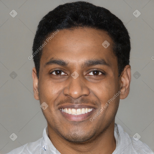 Joyful latino young-adult male with short  black hair and brown eyes