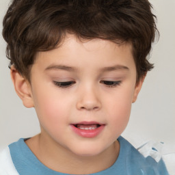 Joyful white child male with short  brown hair and brown eyes