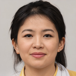 Joyful asian young-adult female with medium  brown hair and brown eyes