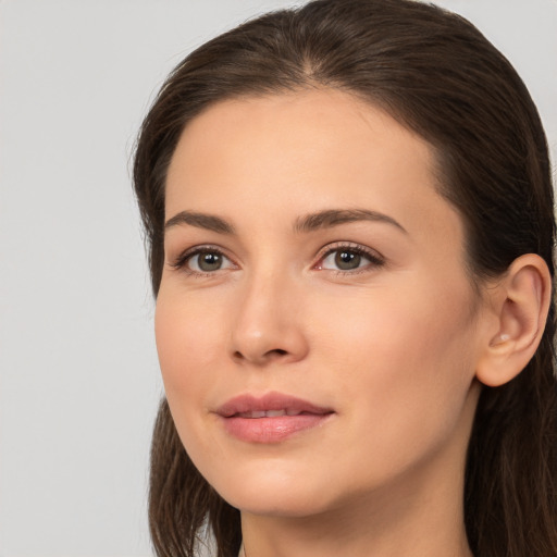 Neutral white young-adult female with long  brown hair and brown eyes