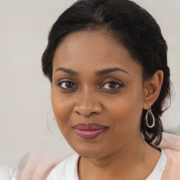 Joyful black young-adult female with medium  brown hair and brown eyes