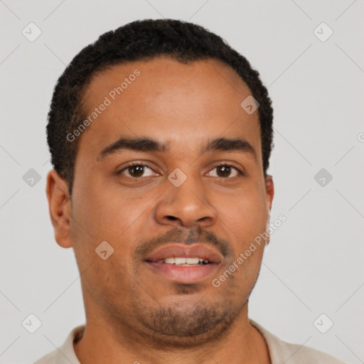 Joyful latino young-adult male with short  brown hair and brown eyes