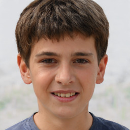 Joyful white child male with short  brown hair and brown eyes