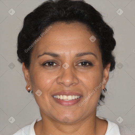 Joyful latino adult female with short  brown hair and brown eyes