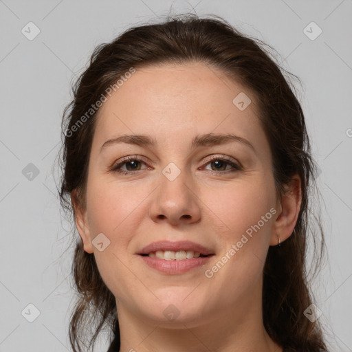 Joyful white young-adult female with medium  brown hair and grey eyes