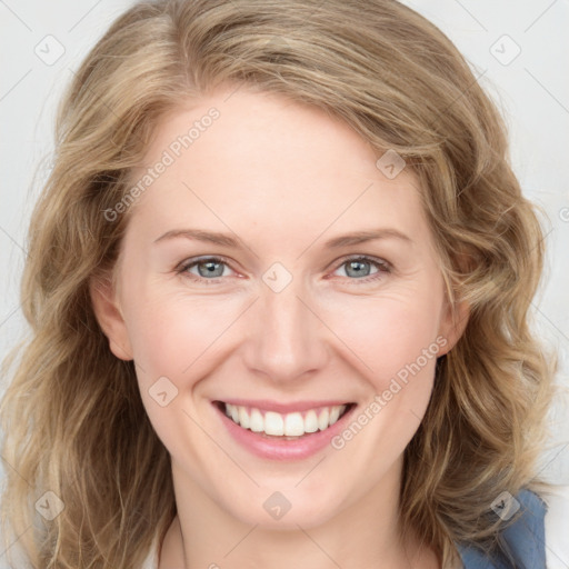 Joyful white young-adult female with medium  brown hair and blue eyes