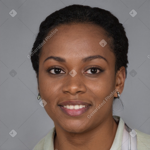 Joyful black young-adult female with short  black hair and brown eyes