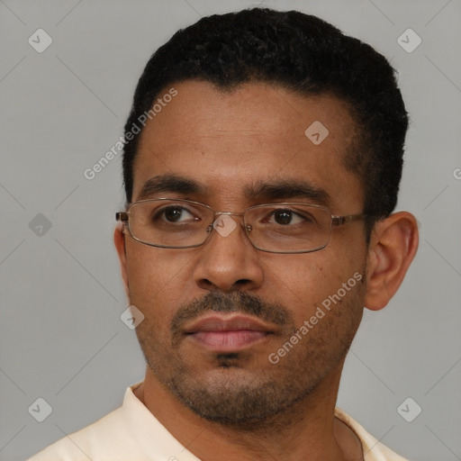 Neutral latino young-adult male with short  black hair and brown eyes